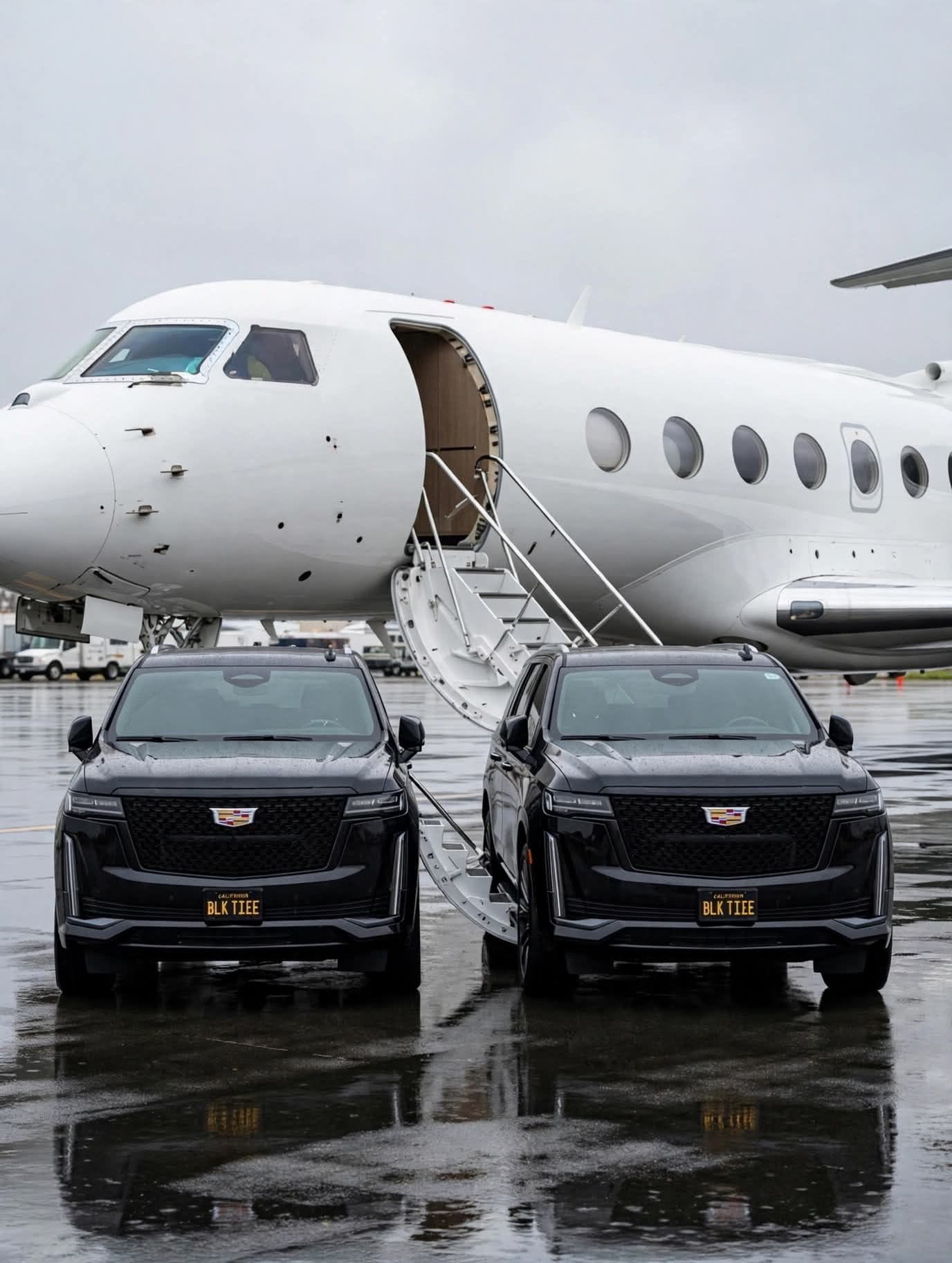 A black Cadillac Escalade positioned among commercial aircraft on an airport apron