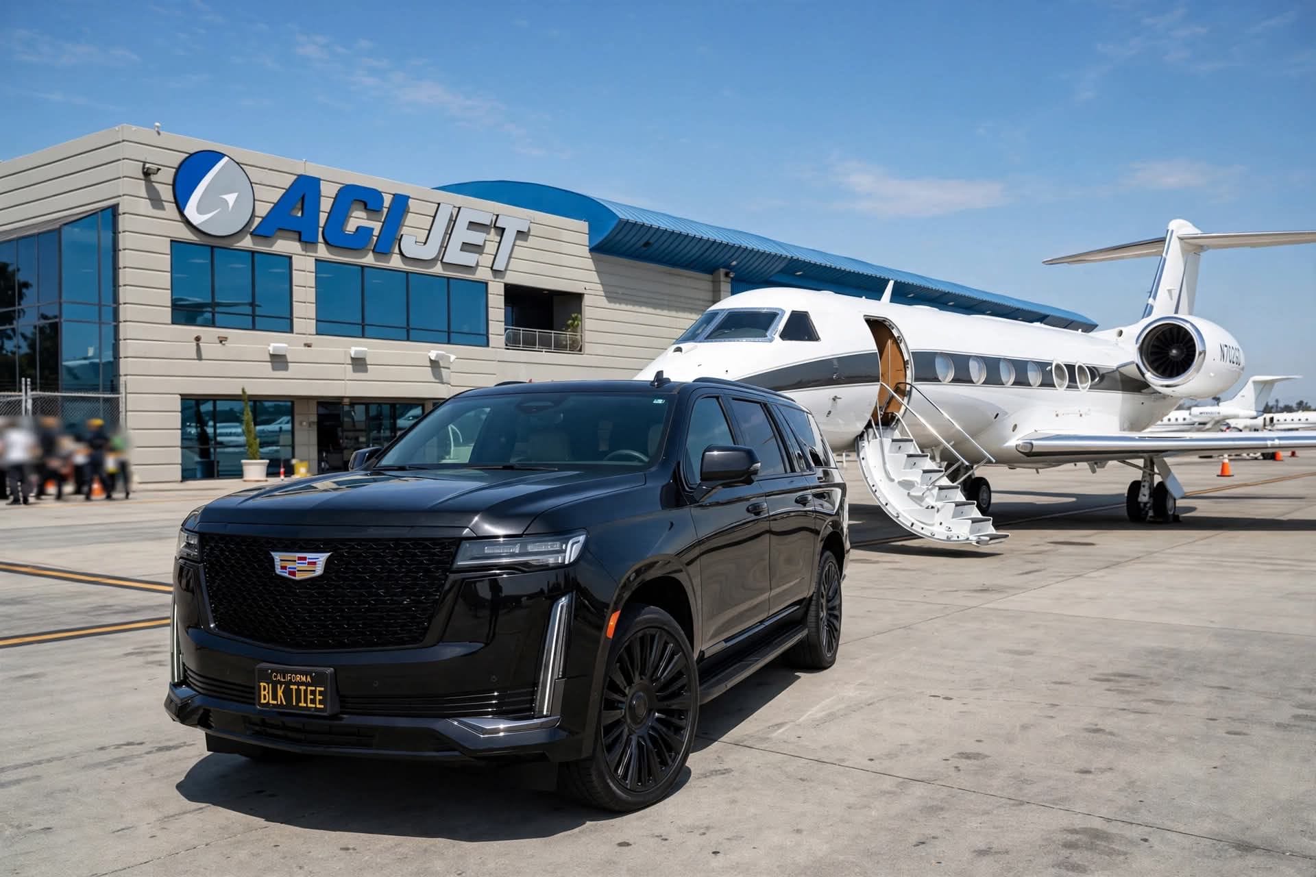 A black Cadillac Escalade waiting on an airport road with a private jet behind it