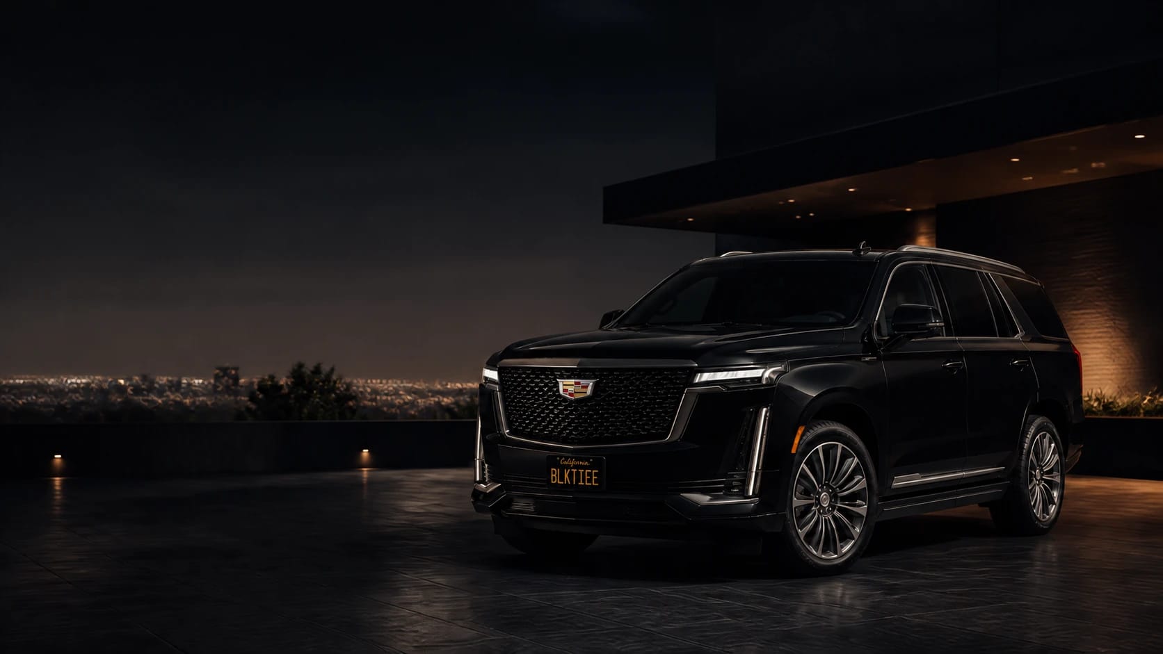 A line of black Cadillac Escalades presented outside a refined arrival entrance